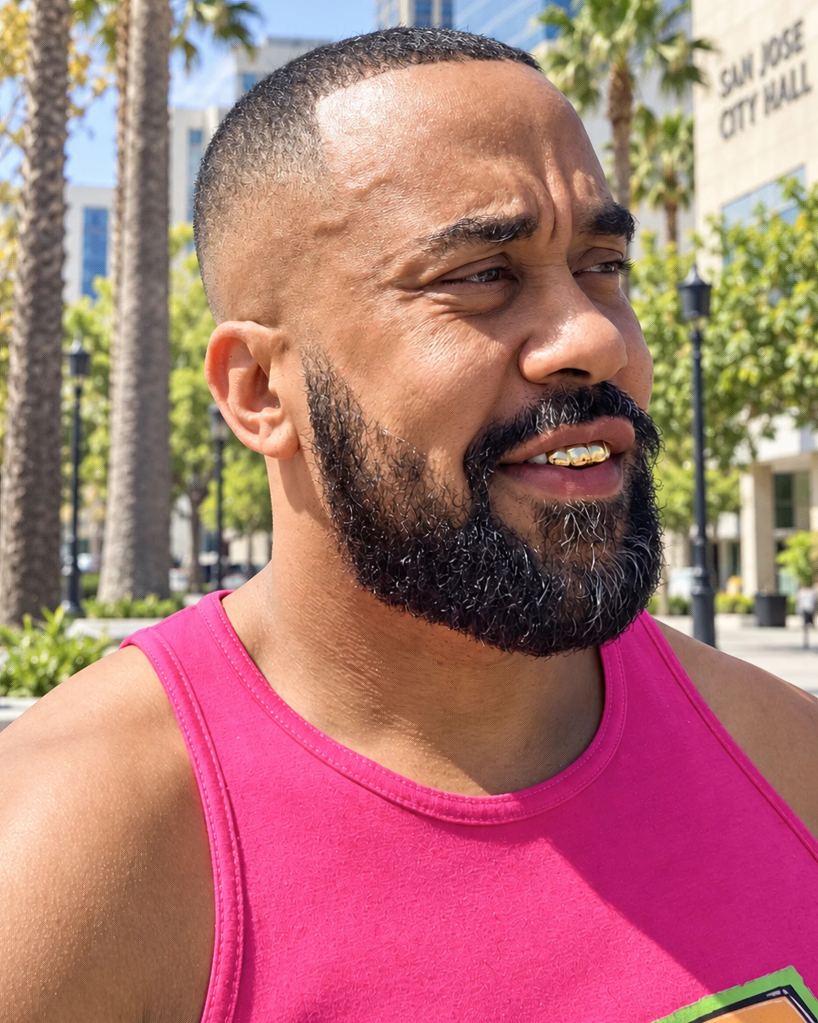 Portrait of Reécho wearing a vivid pink tank top.